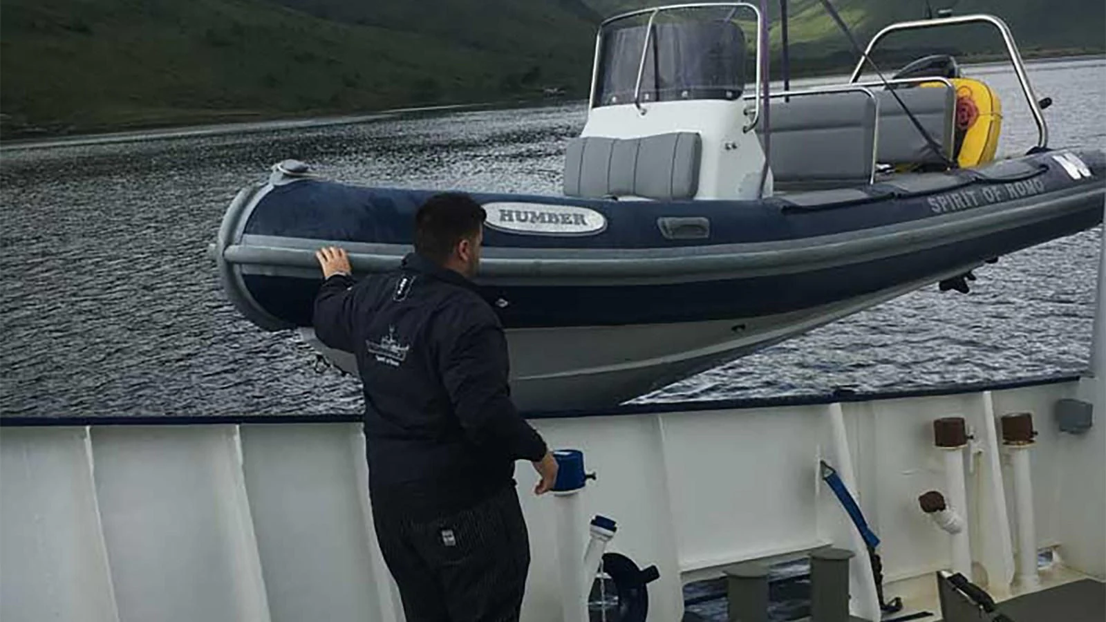 a man standing on a boat aboard SPIRIT OF GINETTE Yacht for Sale
