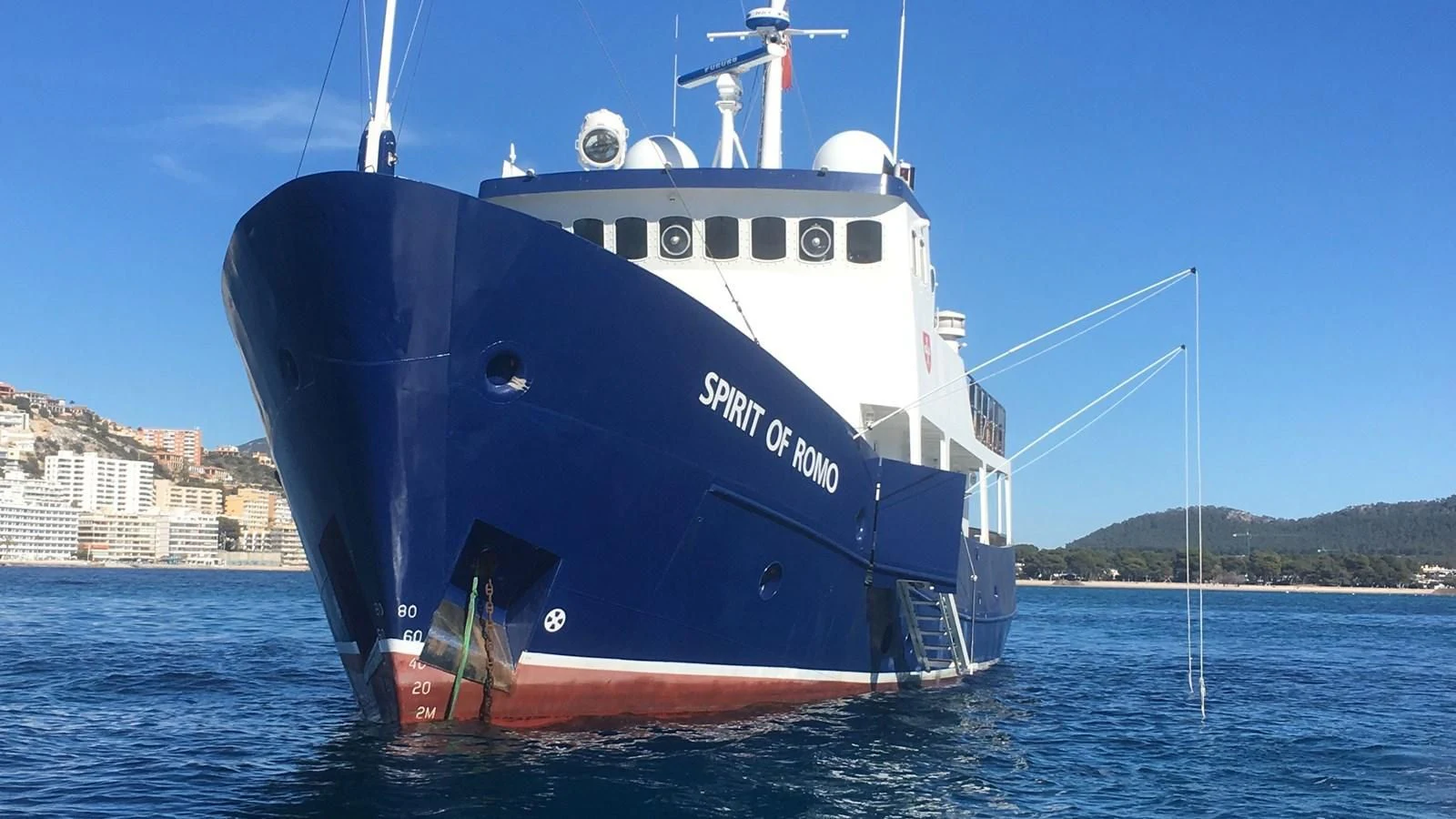 a large blue boat in the water aboard SPIRIT OF GINETTE Yacht for Sale