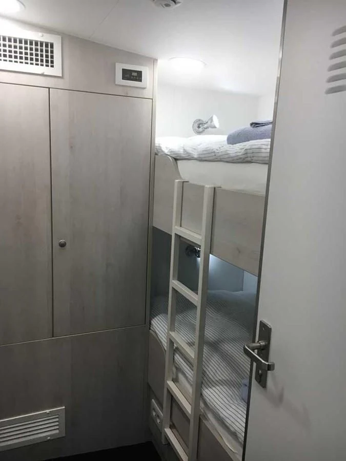a closet with a bed aboard SPIRIT OF GINETTE Yacht for Sale