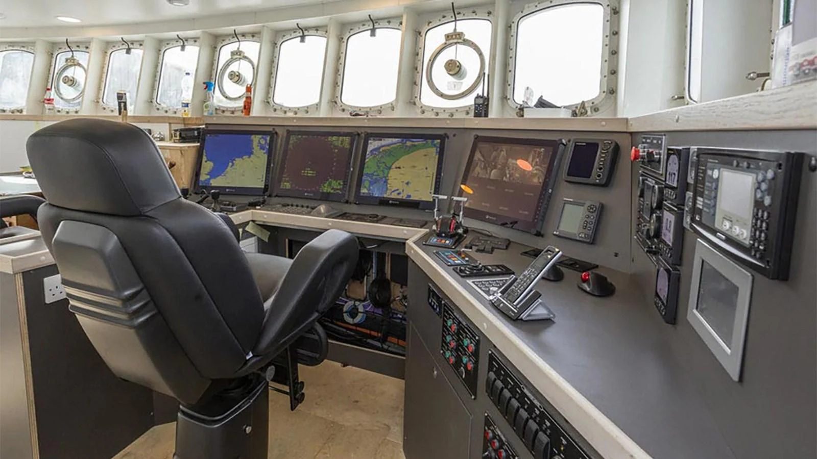 a room with computers and monitors aboard SPIRIT OF GINETTE Yacht for Sale
