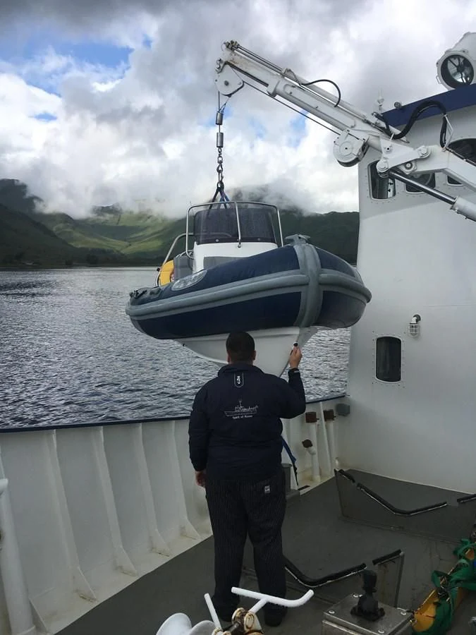 a man standing on a boat aboard SPIRIT OF GINETTE Yacht for Sale