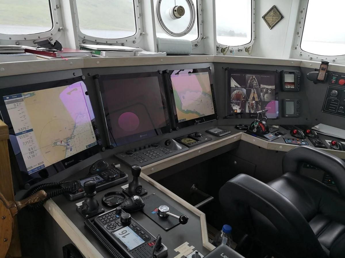 a control room with multiple monitors aboard SPIRIT OF GINETTE Yacht for Sale