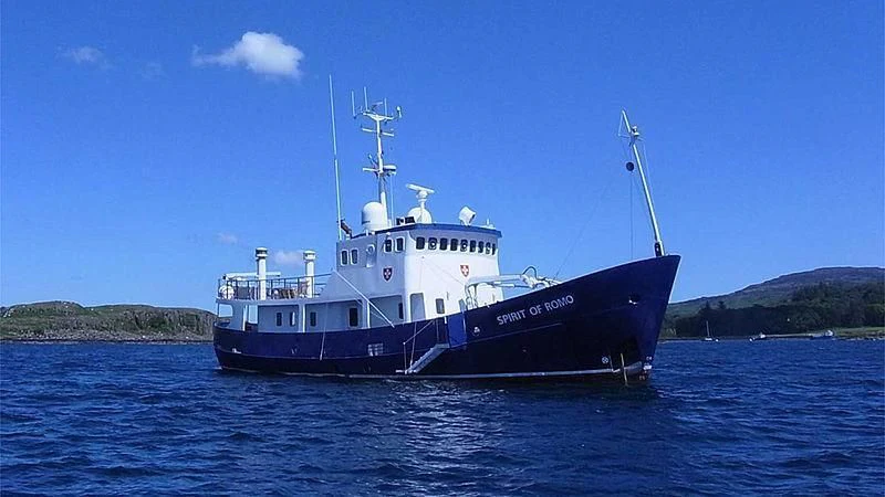 a large blue boat in the water aboard SPIRIT OF GINETTE Yacht for Sale
