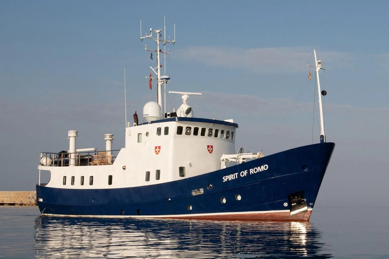 a large blue and white boat aboard SPIRIT OF GINETTE Yacht for Sale