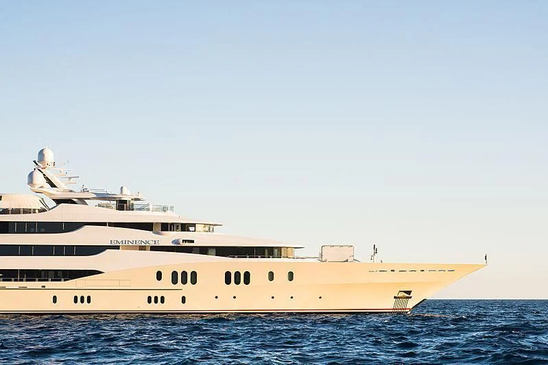 a large white ship in the water aboard EMINENCE Yacht for Sale