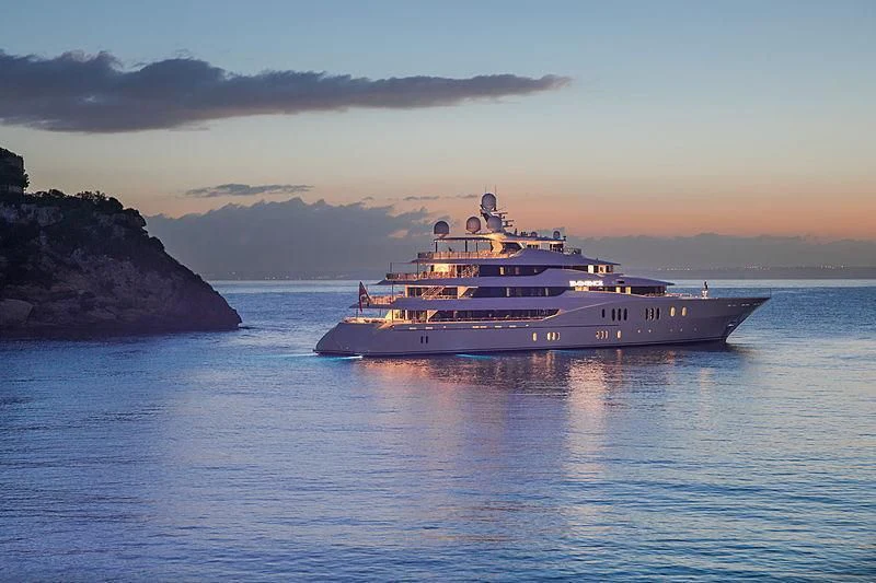 a large ship in the water aboard EMINENCE Yacht for Sale