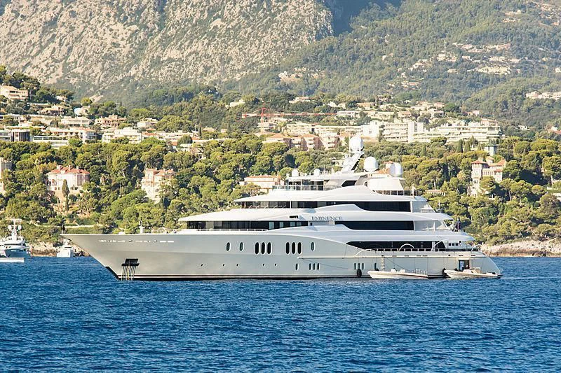 a large white yacht in the water aboard EMINENCE Yacht for Sale