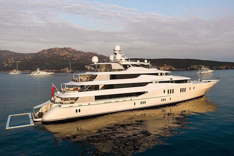 a large white yacht in the water aboard EMINENCE Yacht for Sale
