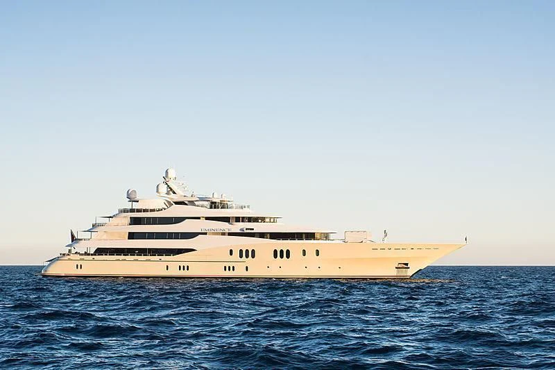a large ship in the water aboard EMINENCE Yacht for Sale