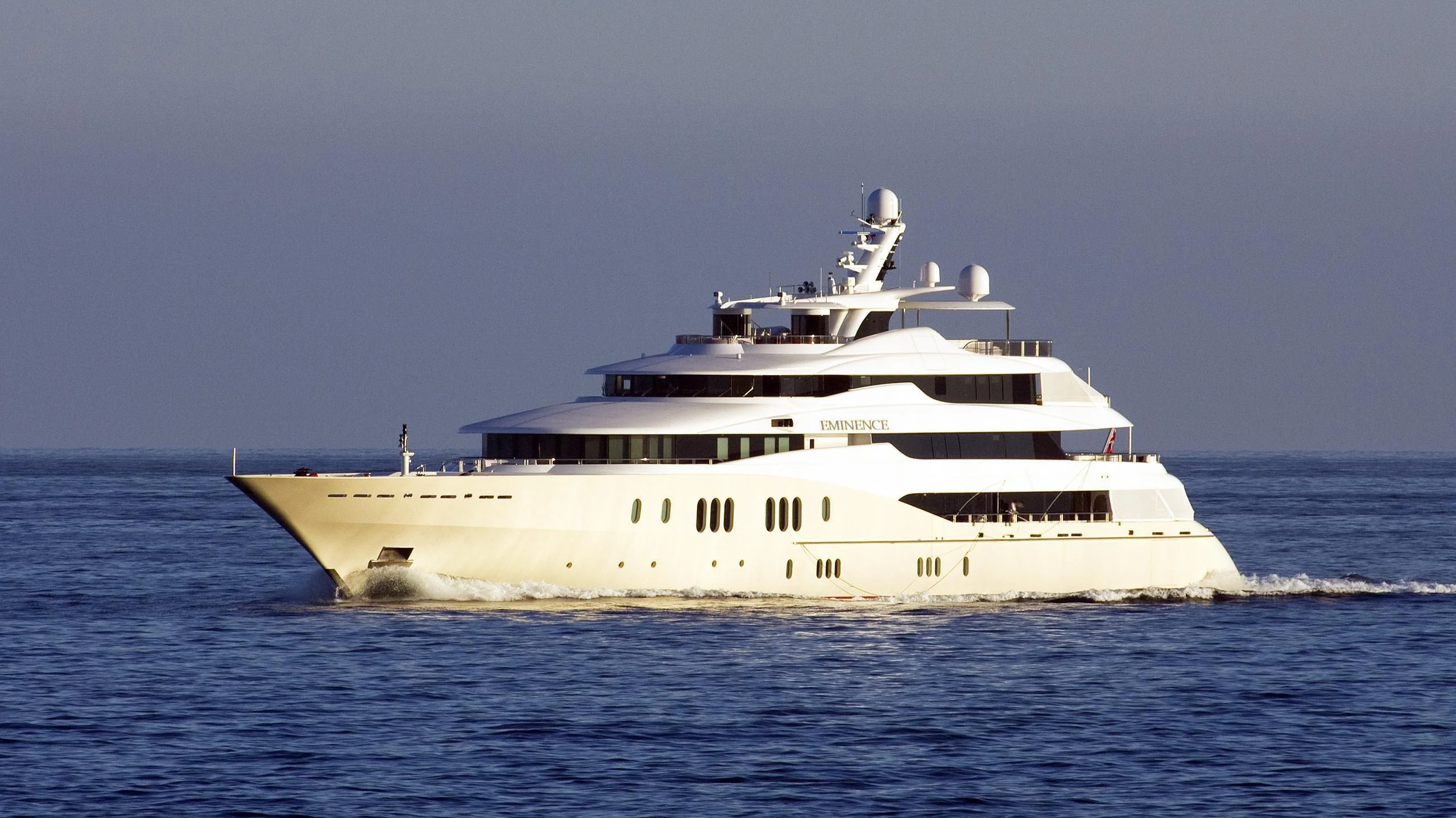a large white ship in the water aboard EMINENCE Yacht for Sale