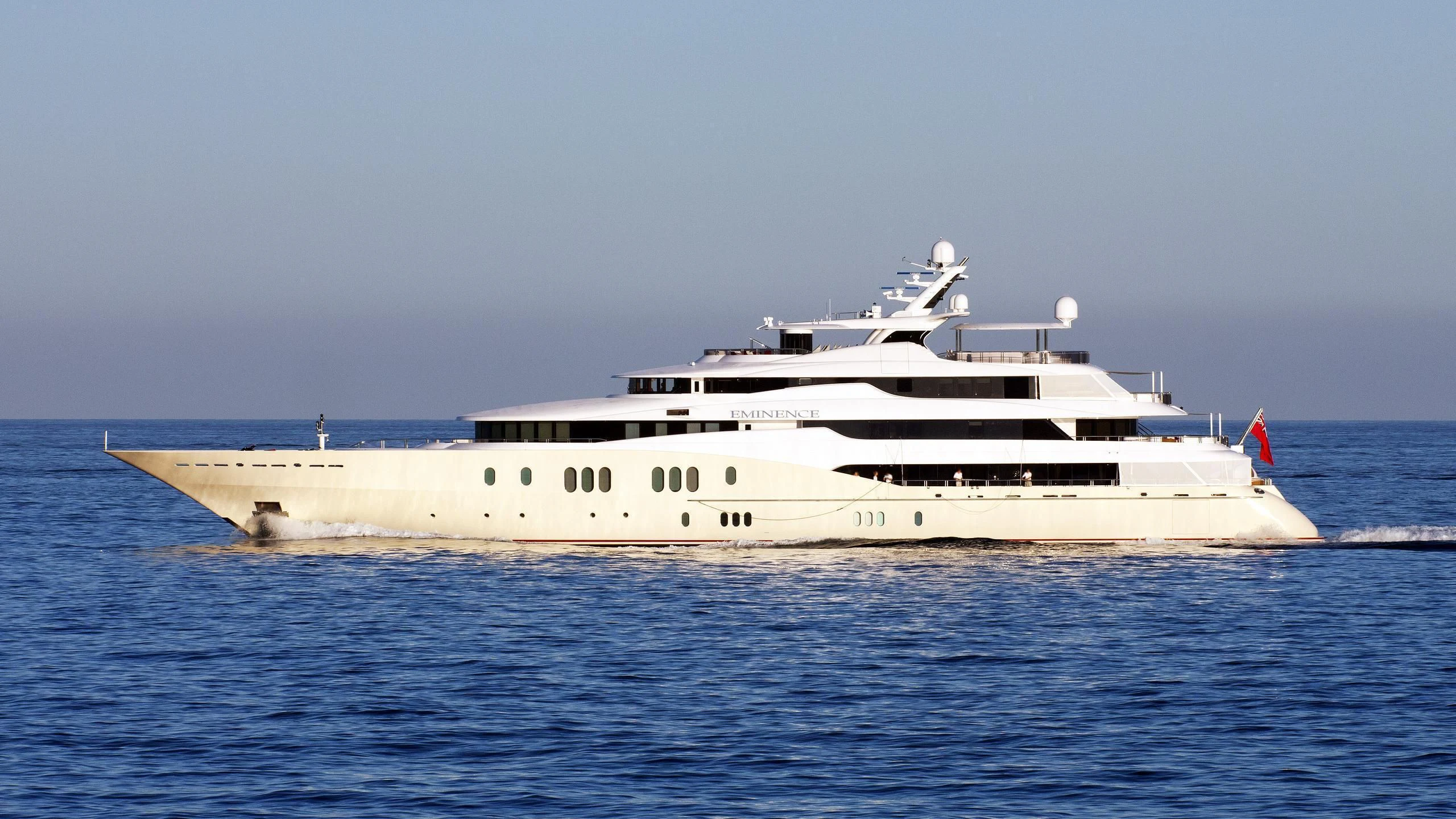 a large white ship in the water aboard EMINENCE Yacht for Sale