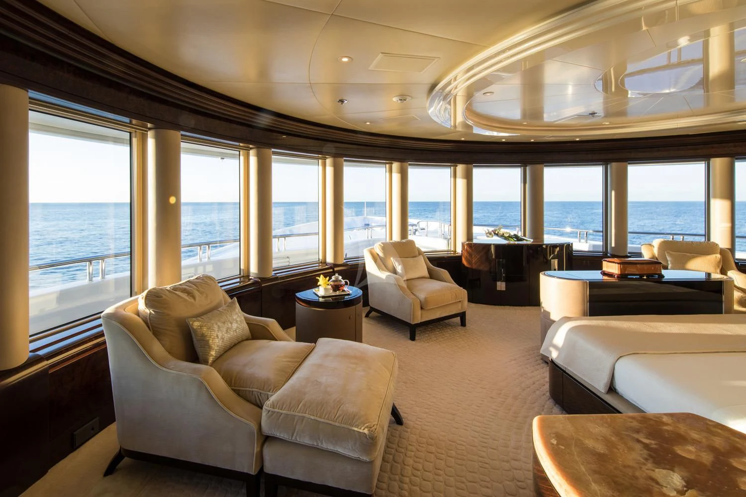 a living room with a large window aboard EMINENCE Yacht for Sale