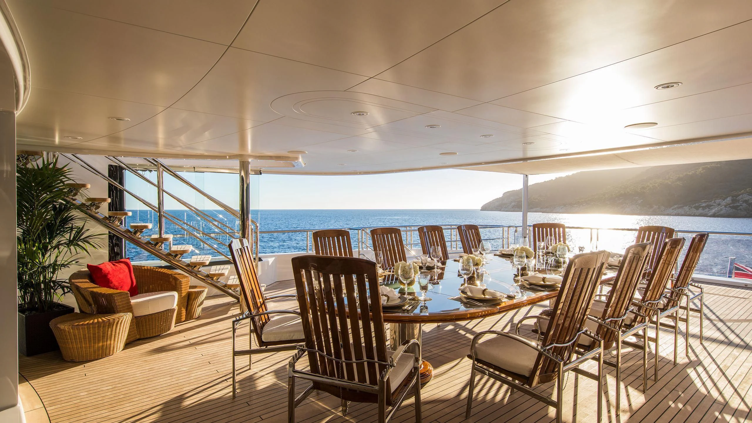 a dining table set for a meal aboard EMINENCE Yacht for Sale