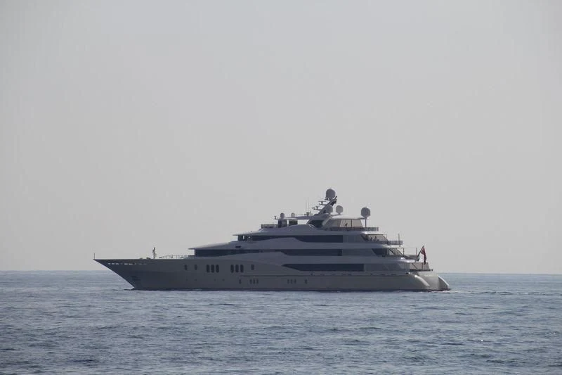 a large ship in the water aboard EMINENCE Yacht for Sale