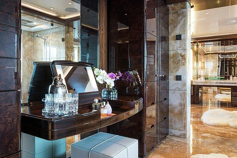 a glass display case with flowers aboard EMINENCE Yacht for Sale