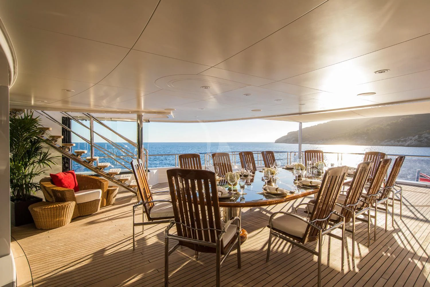 a room with a table and chairs aboard EMINENCE Yacht for Sale