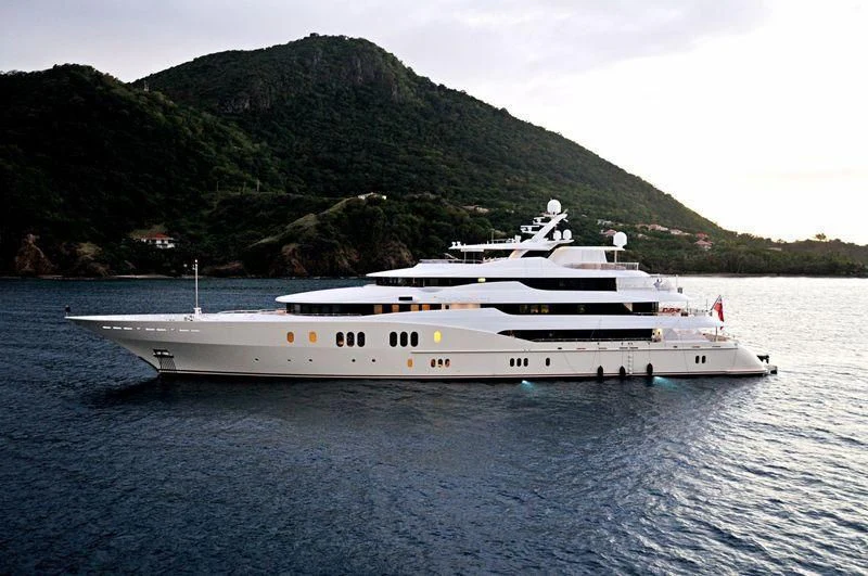 a white yacht in the water aboard EMINENCE Yacht for Sale