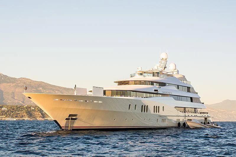a large boat in the water aboard EMINENCE Yacht for Sale