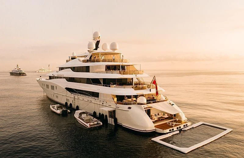 a large ship on the water aboard EMINENCE Yacht for Sale