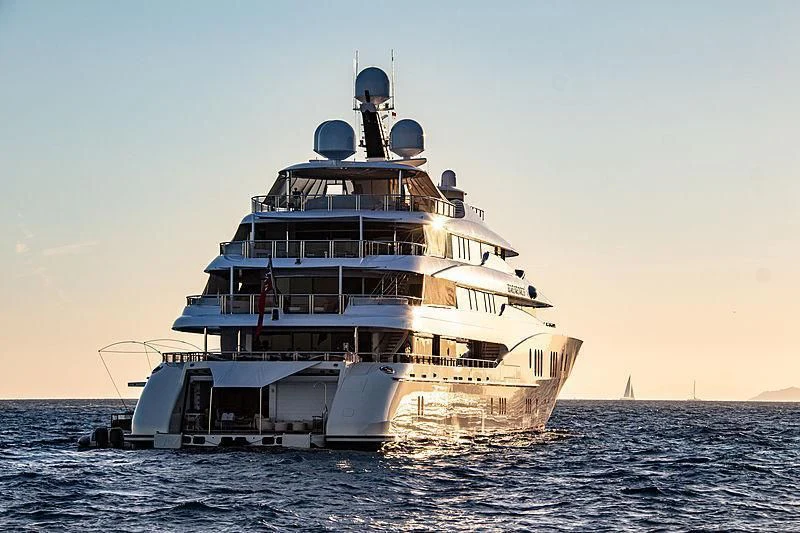 a large boat in the water aboard EMINENCE Yacht for Sale