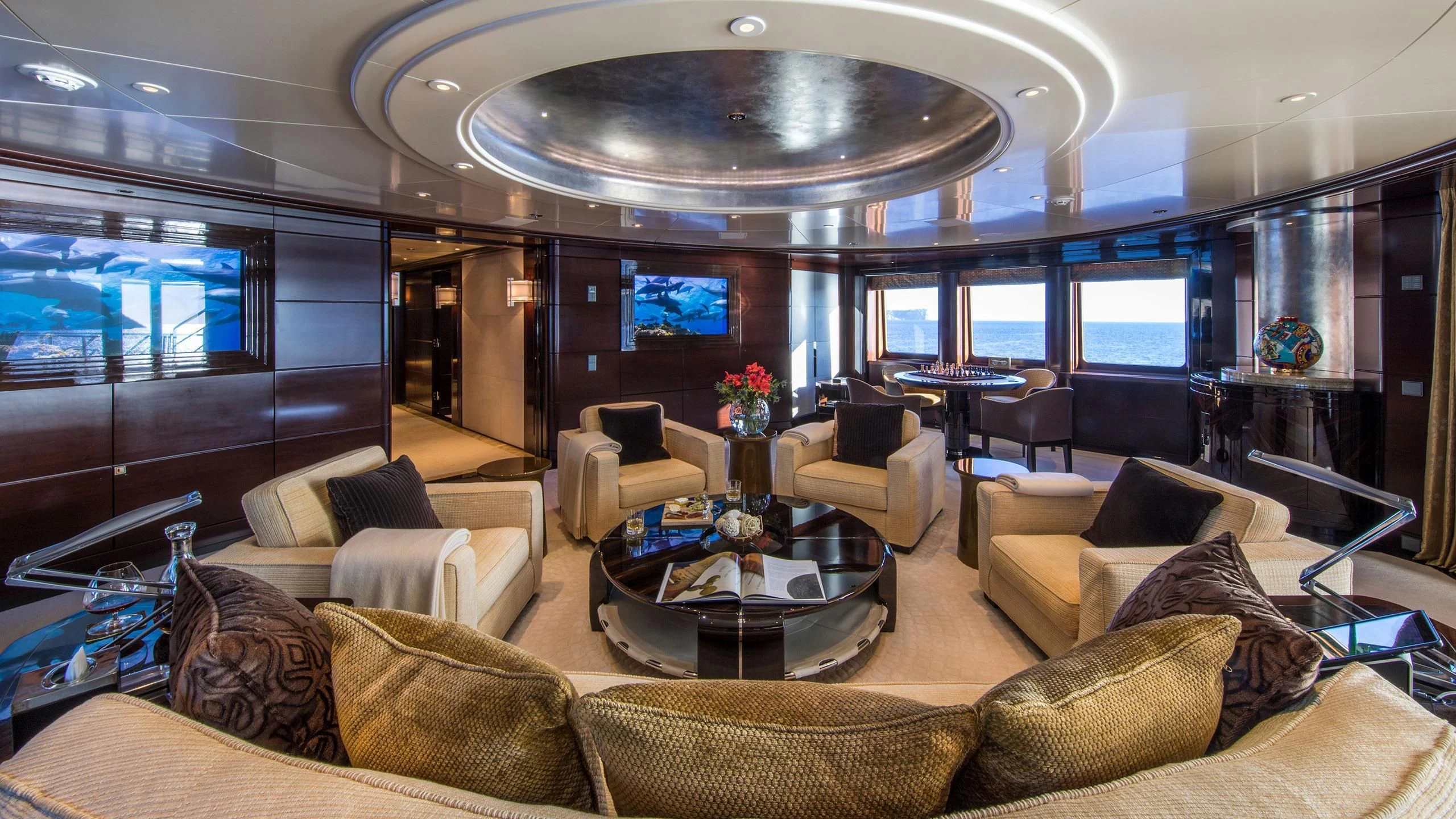 a living room with a large glass ceiling aboard EMINENCE Yacht for Sale