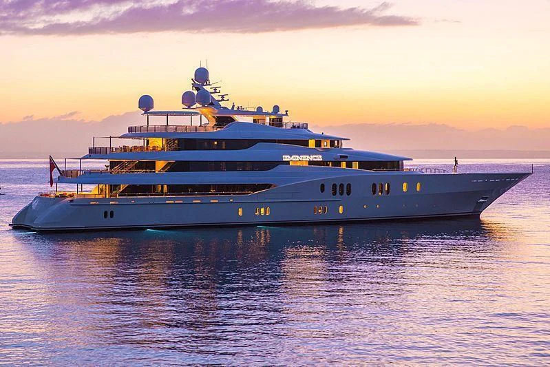a large ship in the water aboard EMINENCE Yacht for Sale