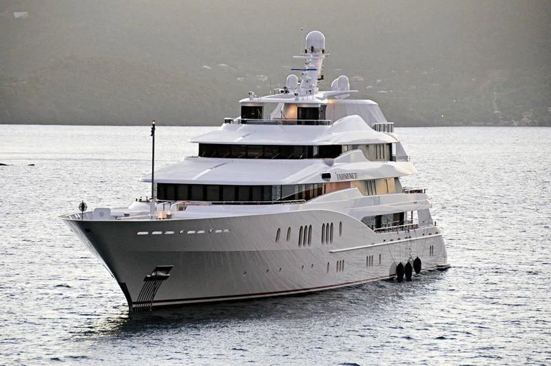 a large white ship in the water aboard EMINENCE Yacht for Sale