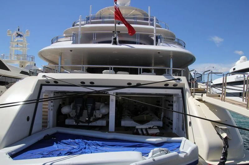a boat with a red stripe on the front aboard EMINENCE Yacht for Sale