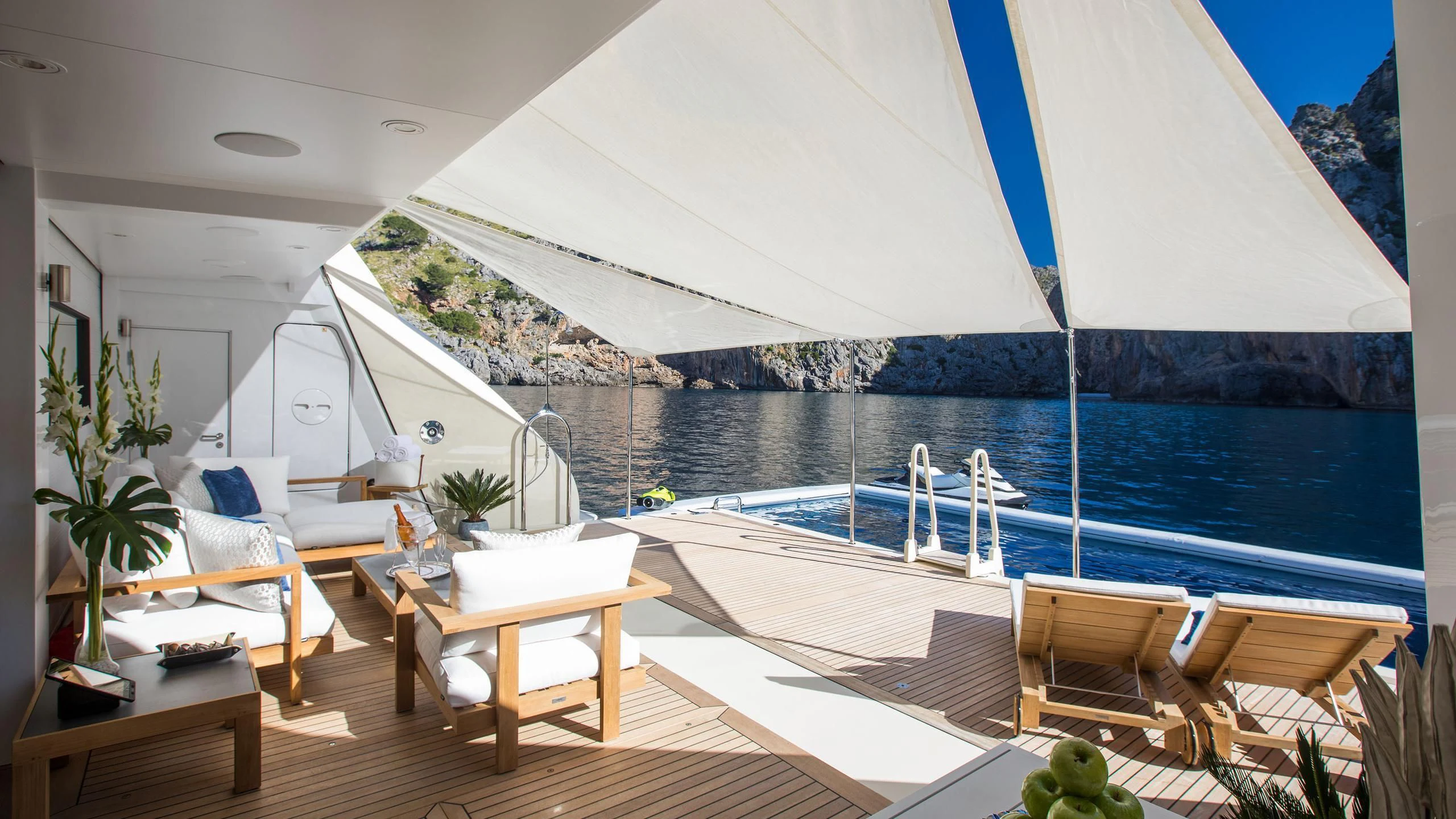 a large white tent with chairs and tables on a deck aboard EMINENCE Yacht for Sale