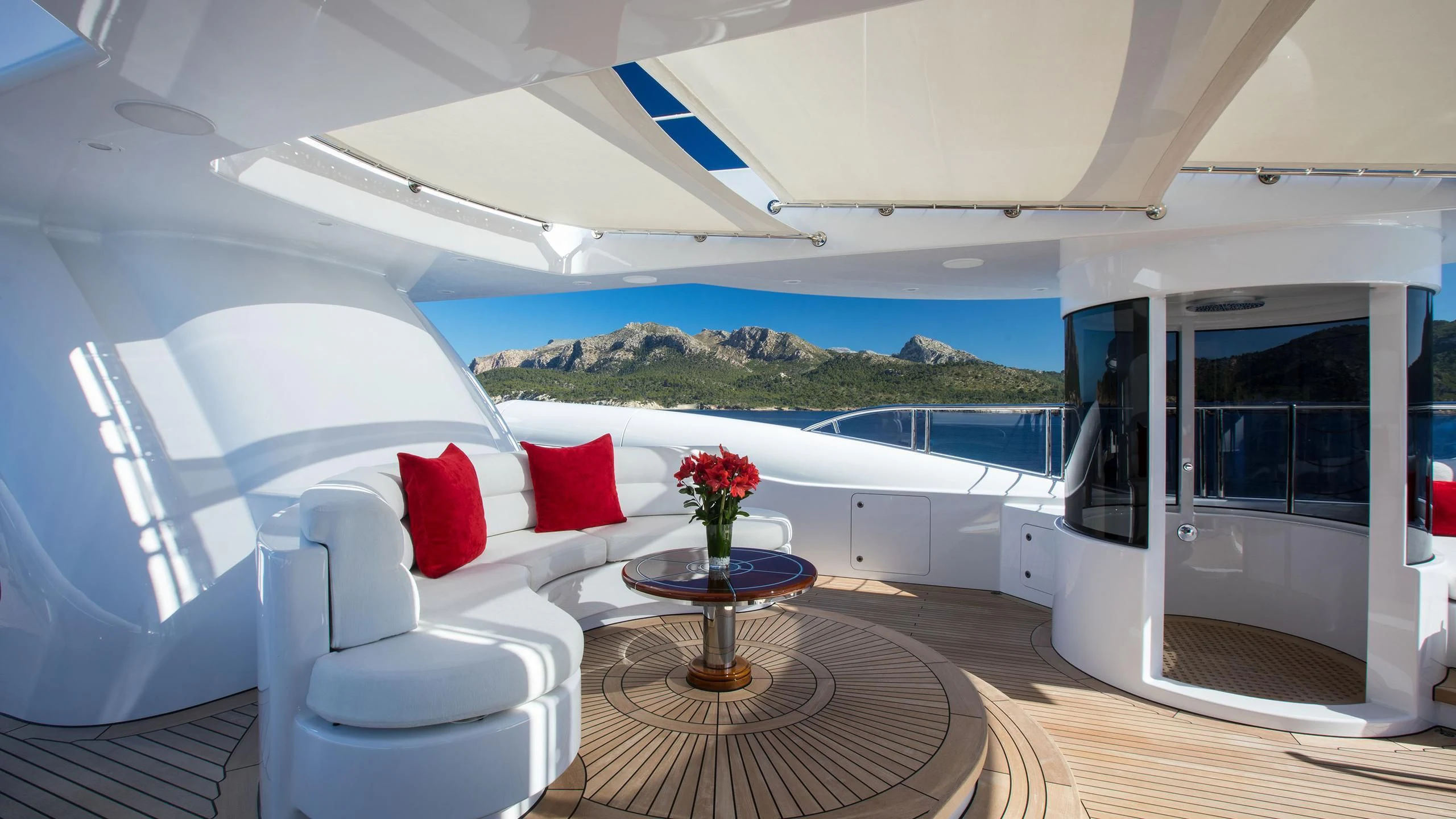 a room with a table and chairs aboard EMINENCE Yacht for Sale