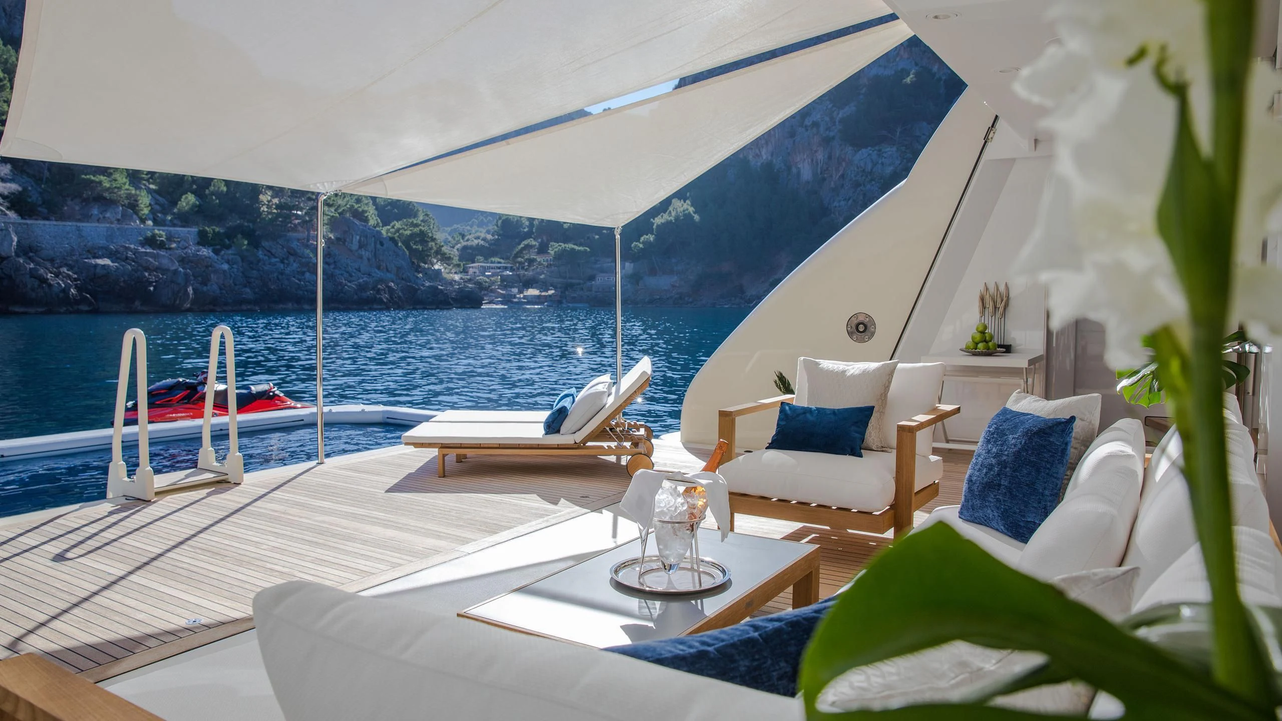 a room with a view of the ocean and a beach aboard EMINENCE Yacht for Sale