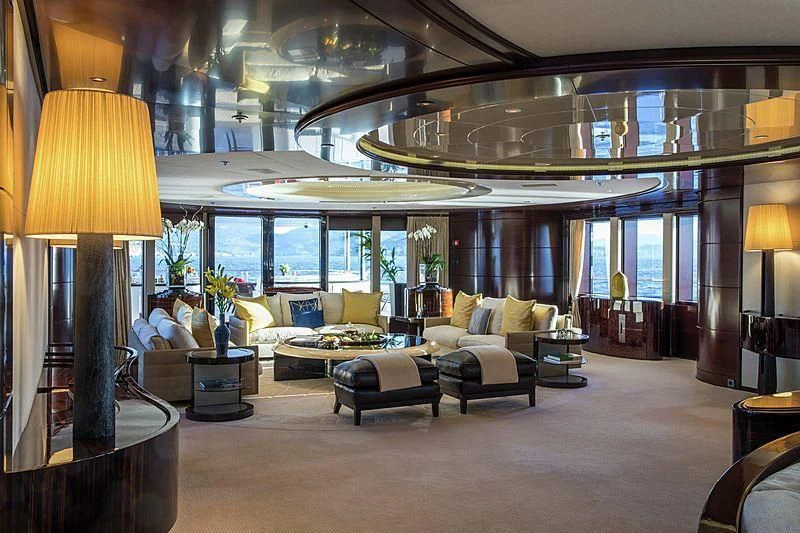 a large living room with a large window aboard EMINENCE Yacht for Sale