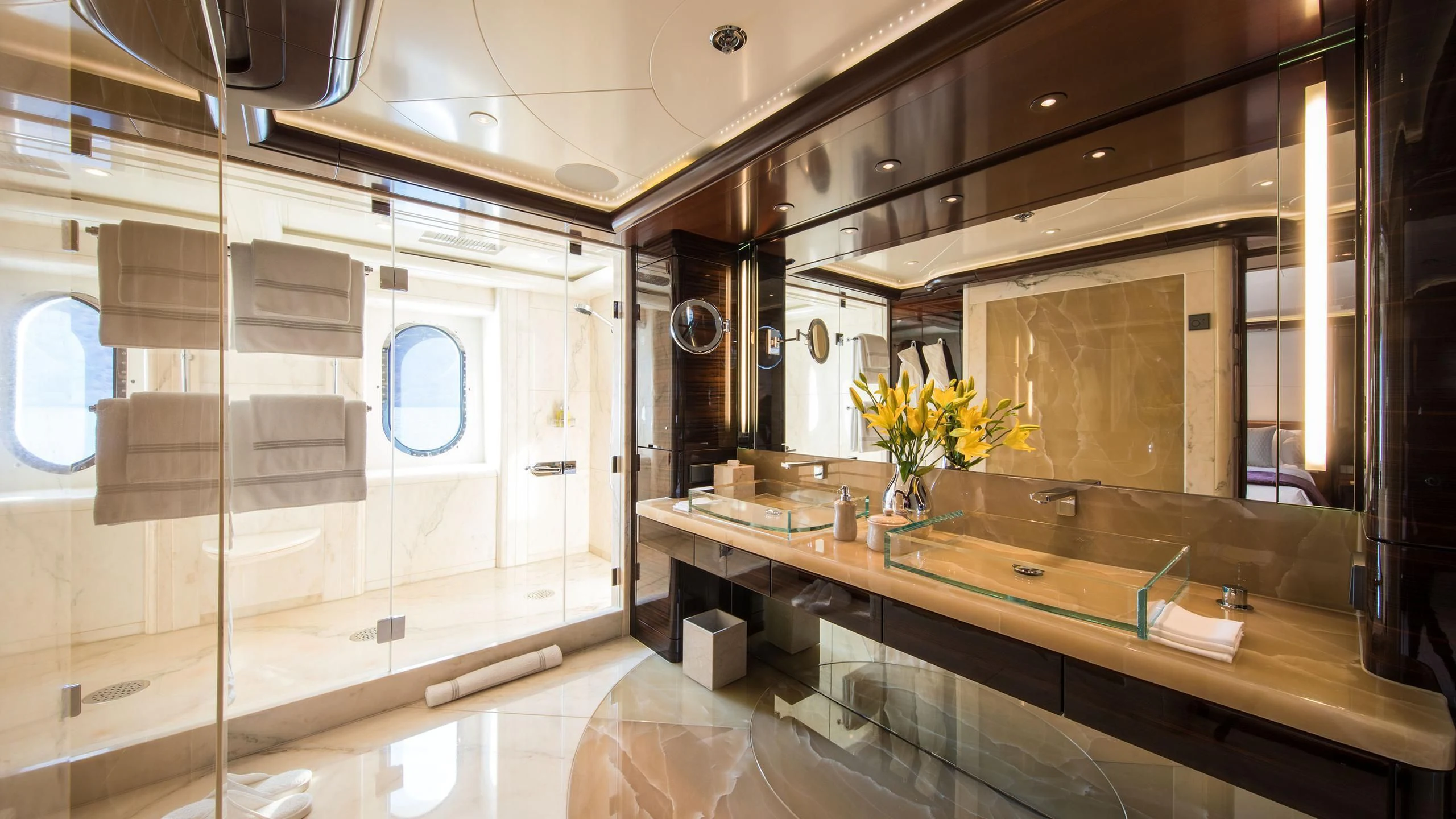 a bathroom with a large mirror aboard EMINENCE Yacht for Sale