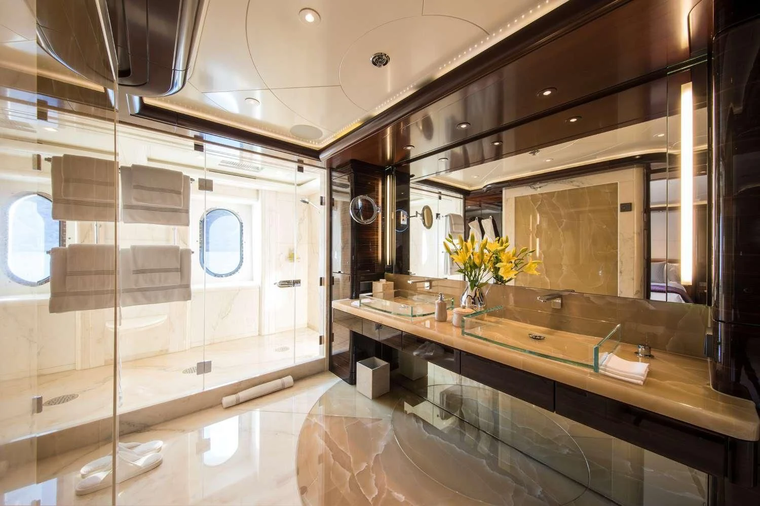 a bathroom with a large mirror aboard EMINENCE Yacht for Sale