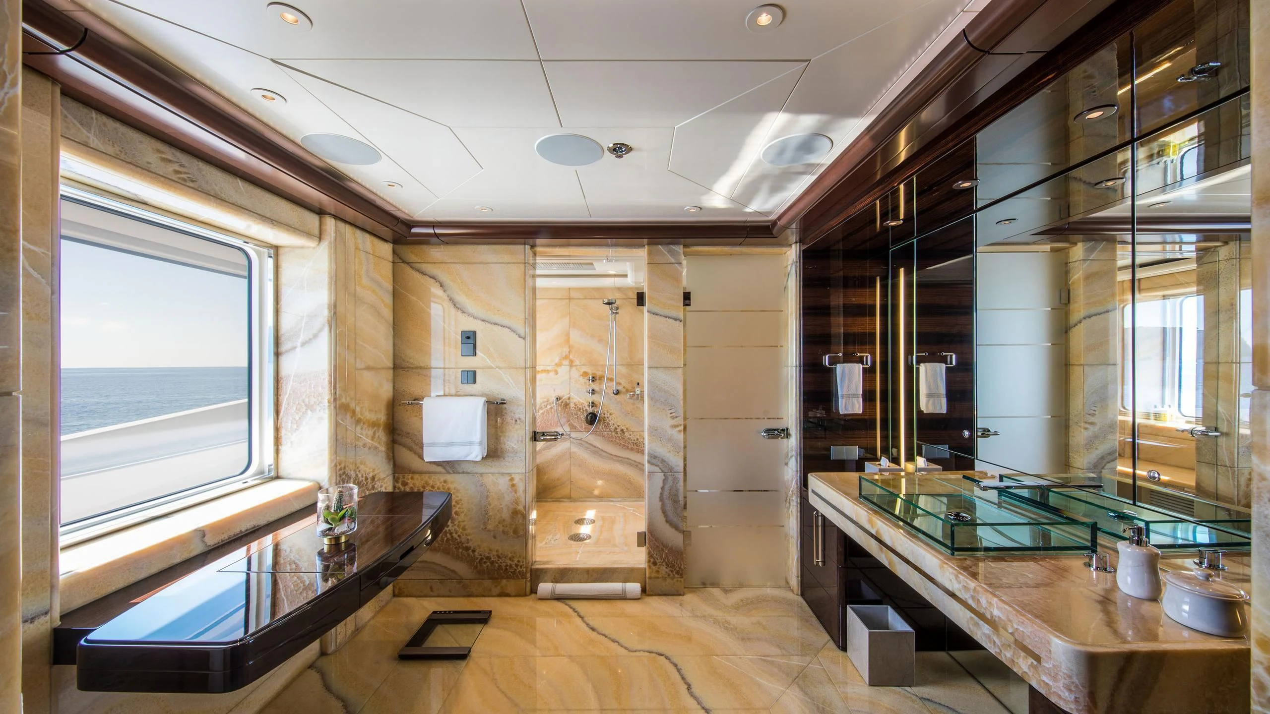 a room with a large glass shower aboard EMINENCE Yacht for Sale