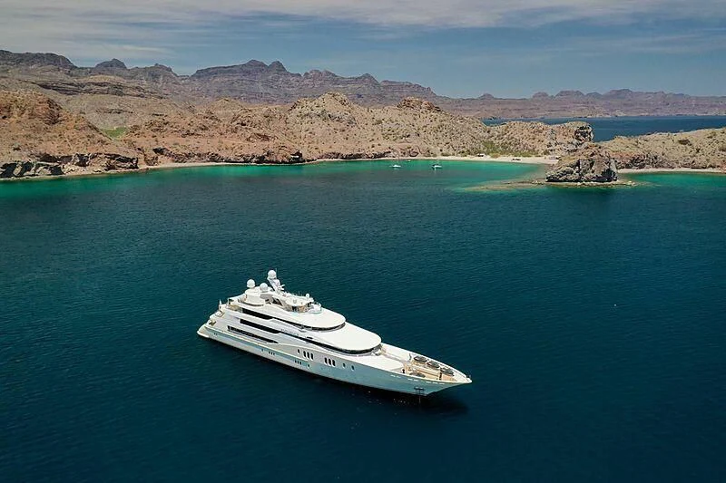 a boat in the water with Lake Mead in the background aboard EMINENCE Yacht for Sale