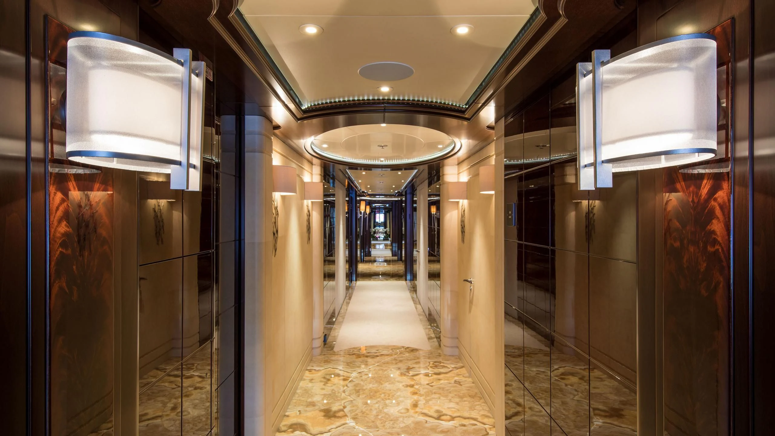 a hallway with a light aboard EMINENCE Yacht for Sale