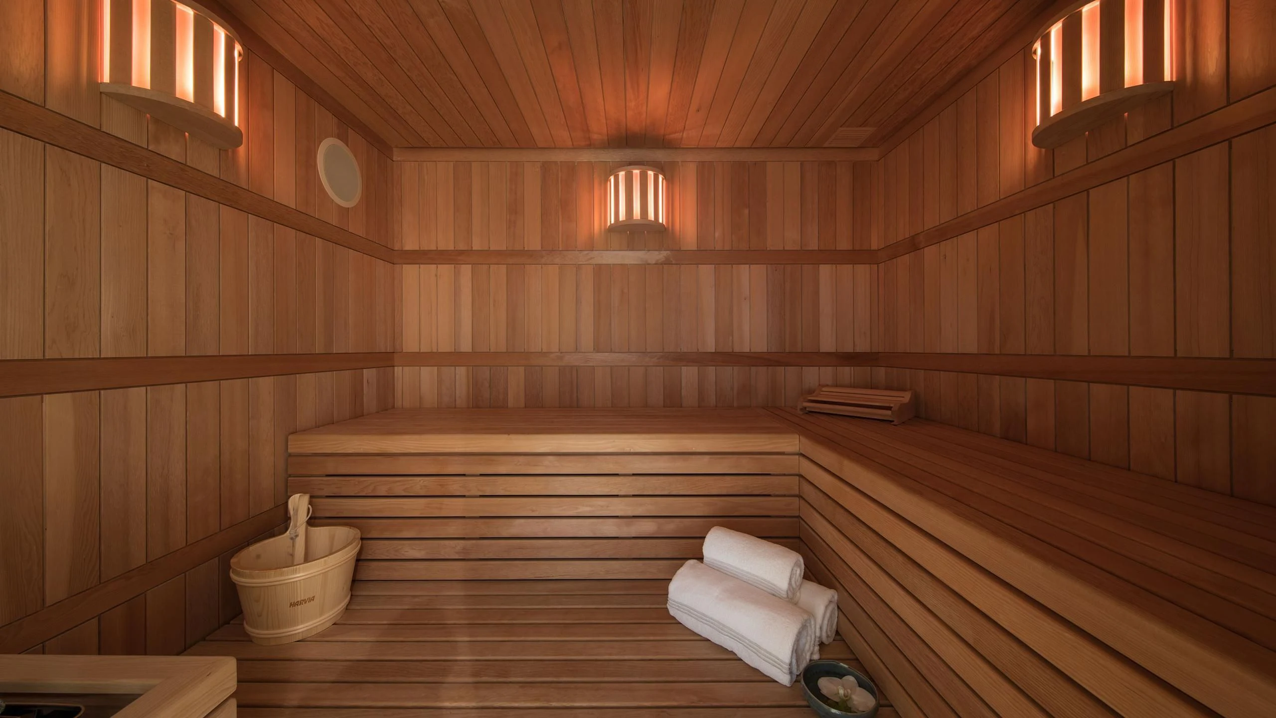 a wooden sauna with wooden walls aboard EMINENCE Yacht for Sale