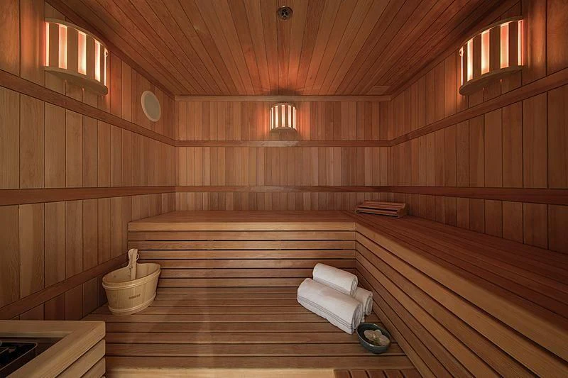 a wooden sauna with wooden walls aboard EMINENCE Yacht for Sale