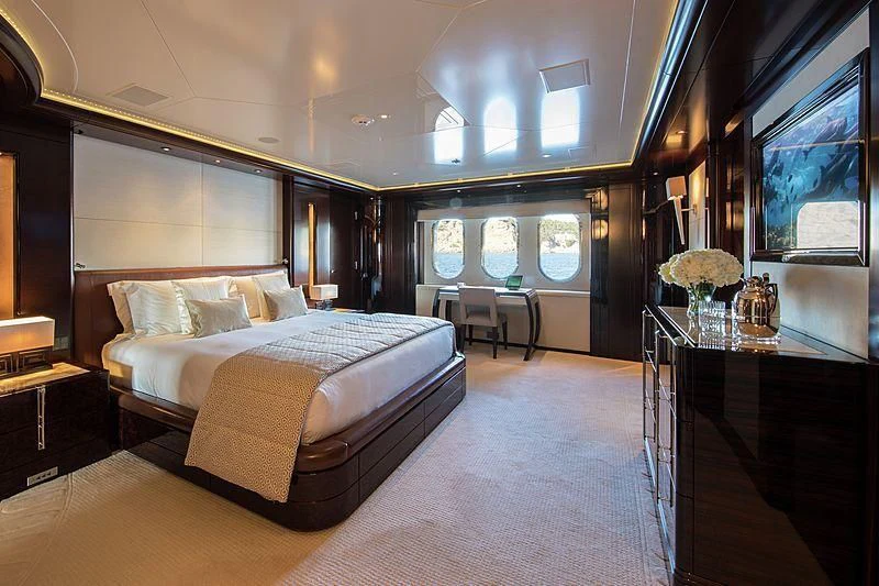 a large bedroom with a large bed aboard EMINENCE Yacht for Sale