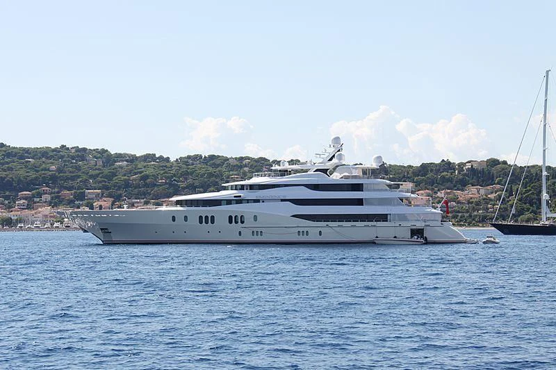 a white yacht in the water aboard EMINENCE Yacht for Sale