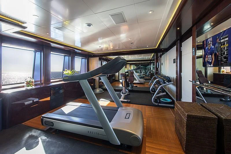 a treadmill in a room aboard EMINENCE Yacht for Sale