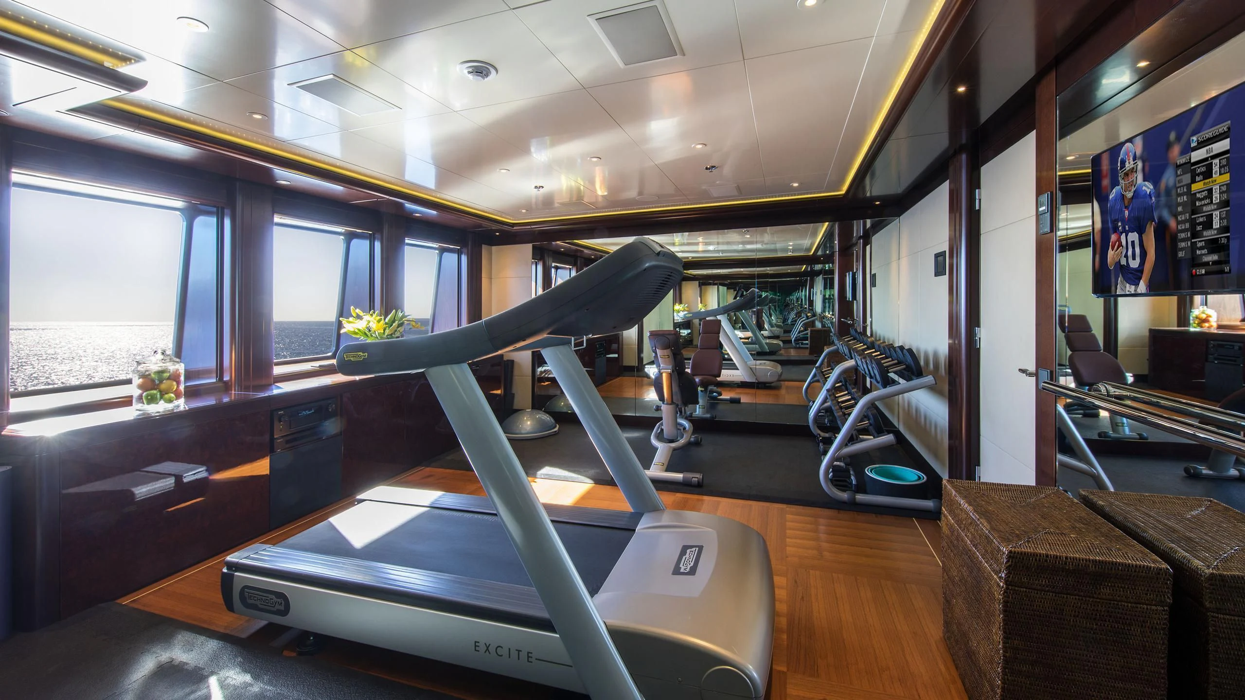 a room with treadmills aboard EMINENCE Yacht for Sale