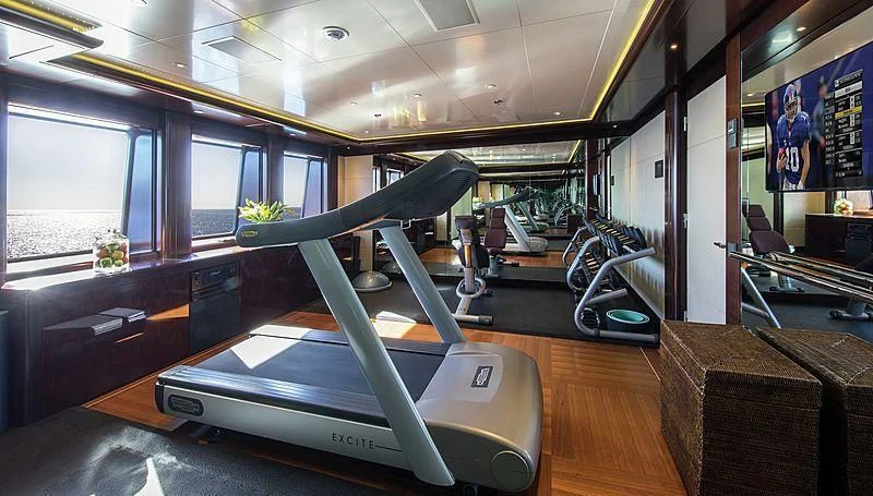 a room with treadmills aboard EMINENCE Yacht for Sale