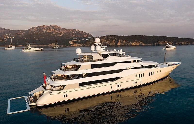 a large white ship in the water aboard EMINENCE Yacht for Sale