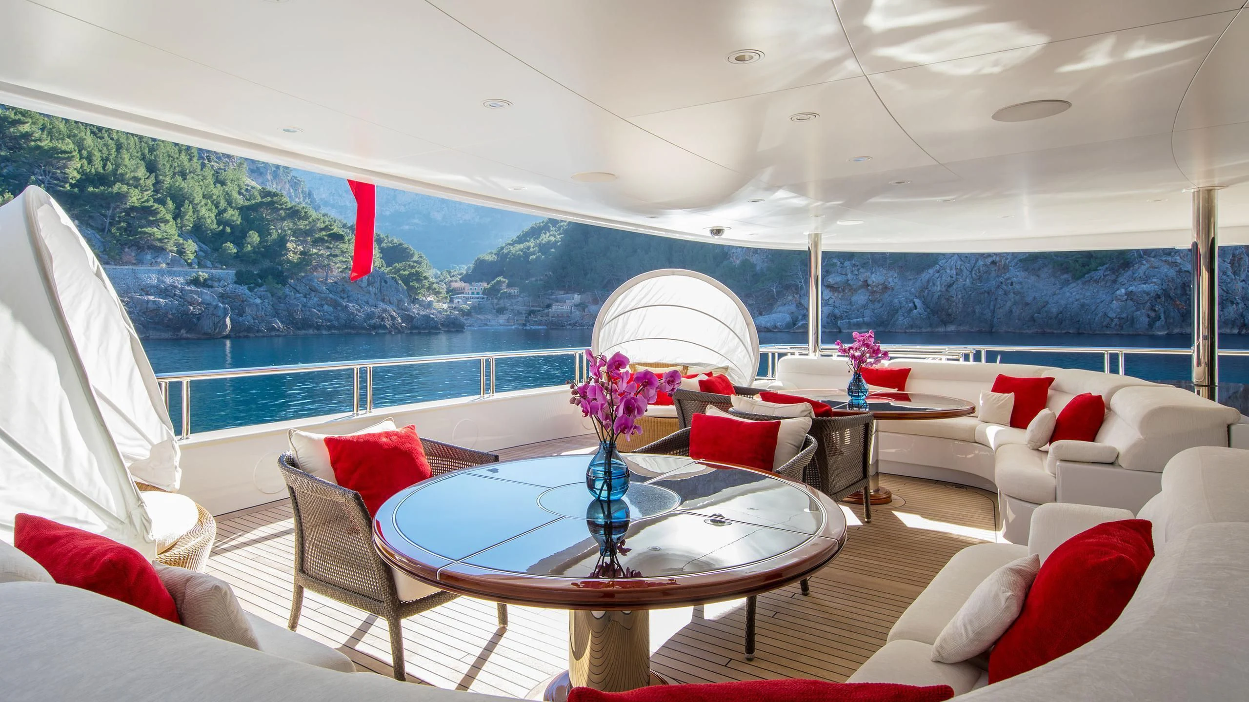 a room with a table and chairs aboard EMINENCE Yacht for Sale