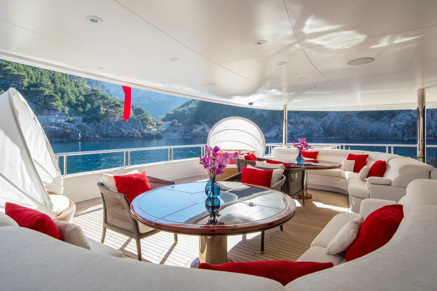 a room with a table and chairs aboard EMINENCE Yacht for Sale