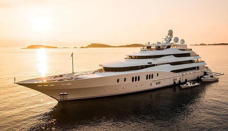a large white ship on the water aboard EMINENCE Yacht for Sale