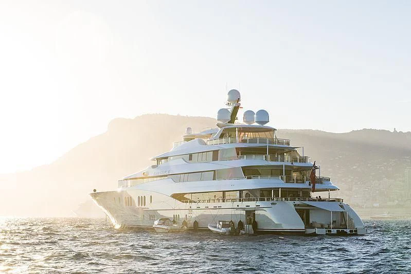 a large ship in the water aboard EMINENCE Yacht for Sale