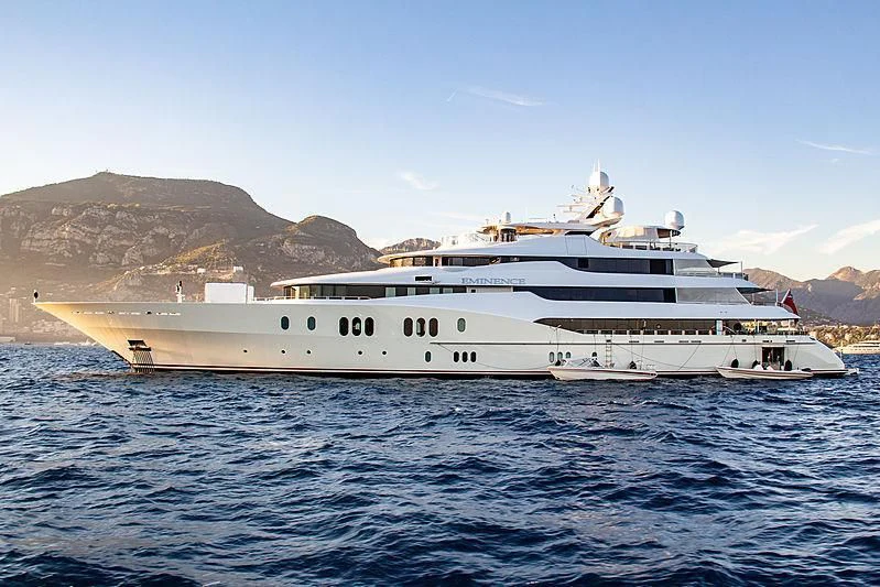 a large white yacht in the water aboard EMINENCE Yacht for Sale